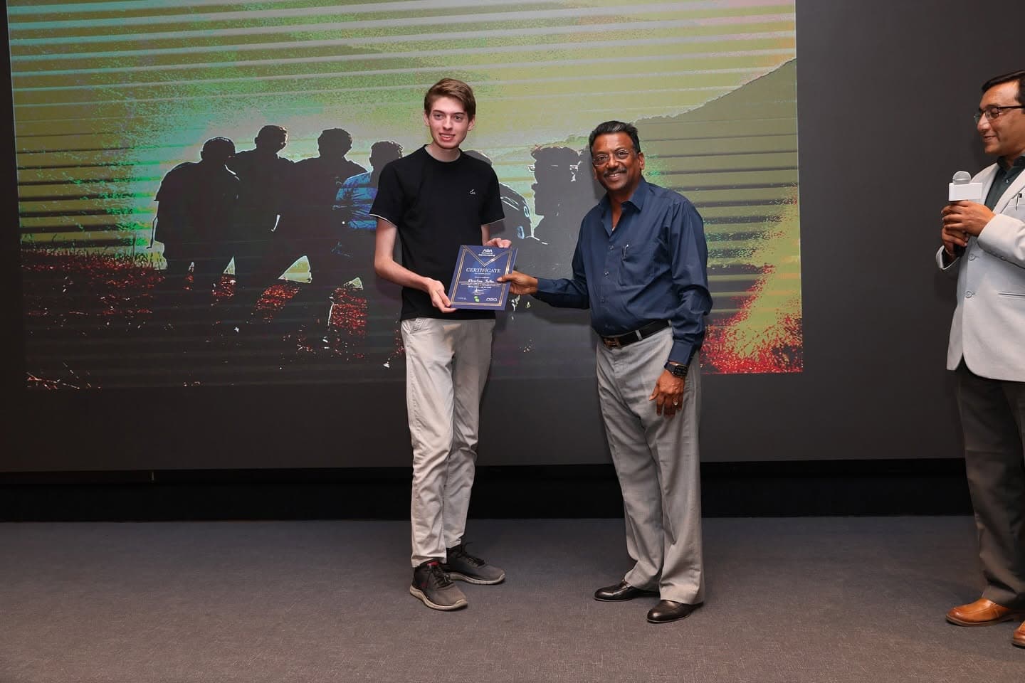 A young finalist receiving a certificate